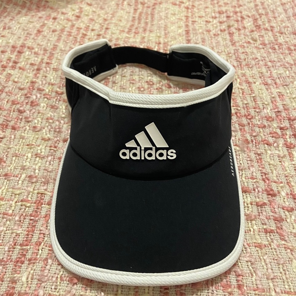 This is a Adidas Black Visor with white details
